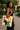 Woman holding a tote bag with 'LOVE Africa' design in an outdoor setting