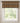 Window with a patterned curtain valance against a neutral wall.