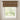 Window with a patterned curtain valance against a neutral wall.
