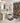 Bathroom with patterned shower curtain, rug, and toilet cover