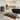 Modern bathroom with a black and white patterned rug on the floor.