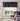 Geometric patterned valance in a bedroom setting with a bed and window.