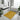 Yellow patterned rug in a modern bathroom with a sink, bathtub, and plants.