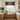 Modern kitchen with wooden cabinets, white countertops, and a patterned curtain.
