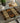 Placemat with geometric pattern on a glass table with cutlery and teapot.