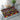 Geometric patterned placemat on a glass table with a teapot and cup.