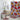Bathroom with a colorful floral-patterned shower curtain, toilet seat cover, and bath mat.