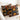 Two decorative pillows with tribal patterns on a white couch.