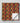 Patterned blanket with red, yellow, and black colors on a gray background