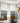 Living room with patterned curtains and abstract art on the wall