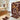 Bathroom with patterned shower curtain, rug, and toilet cover
