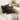 Decorative pillow with geometric pattern on a white couch