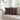 Patterned throw pillows on a beige sofa in a living room setting.
