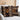 Two decorative pillows with geometric patterns on a light-colored sofa.