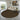 Round patterned rug in a modern living room with a sofa and decor.