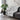 Black and white patterned throw blanket draped over a gray sofa in a living room setting.